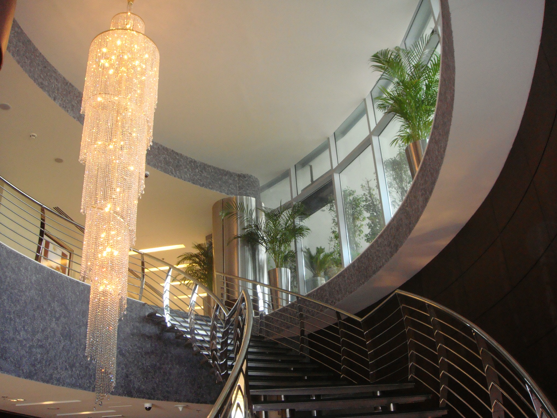 Sculptural staircase and chandelier in the Ramada hotel lobby