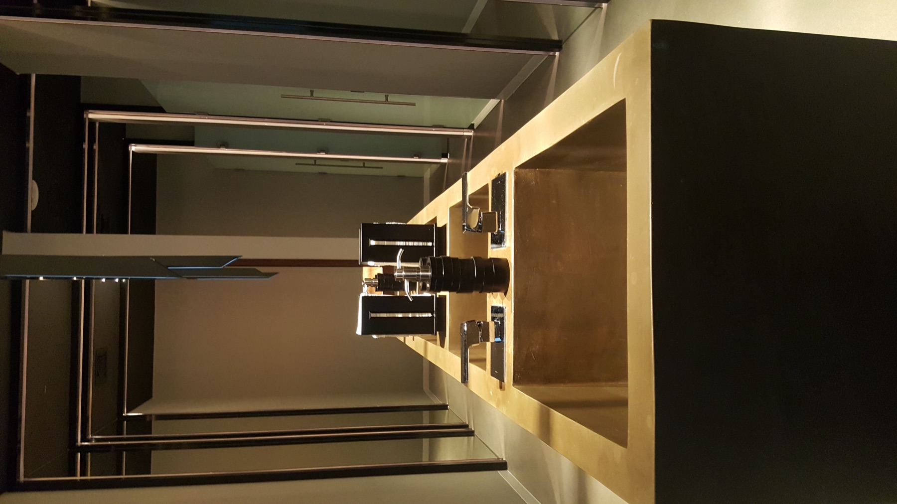 Dark luxury bathroom with a hand-finished zinc vanity